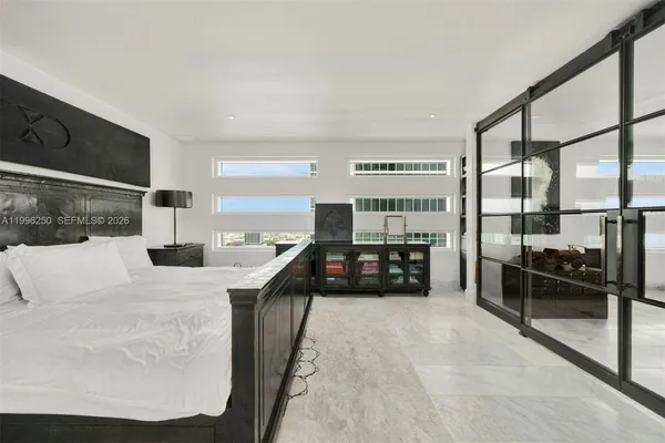 a bathroom with a shower sink and mirror
