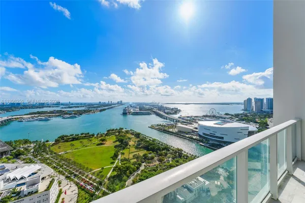 a view of a swimming pool with outdoor seating