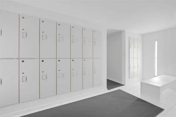 a view of a closet area with living room