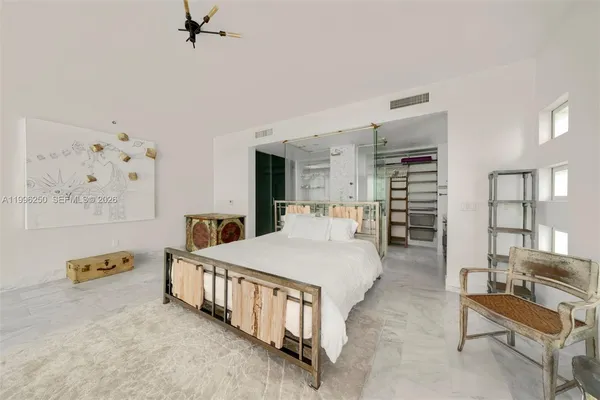 a bed room with a bed and furniture