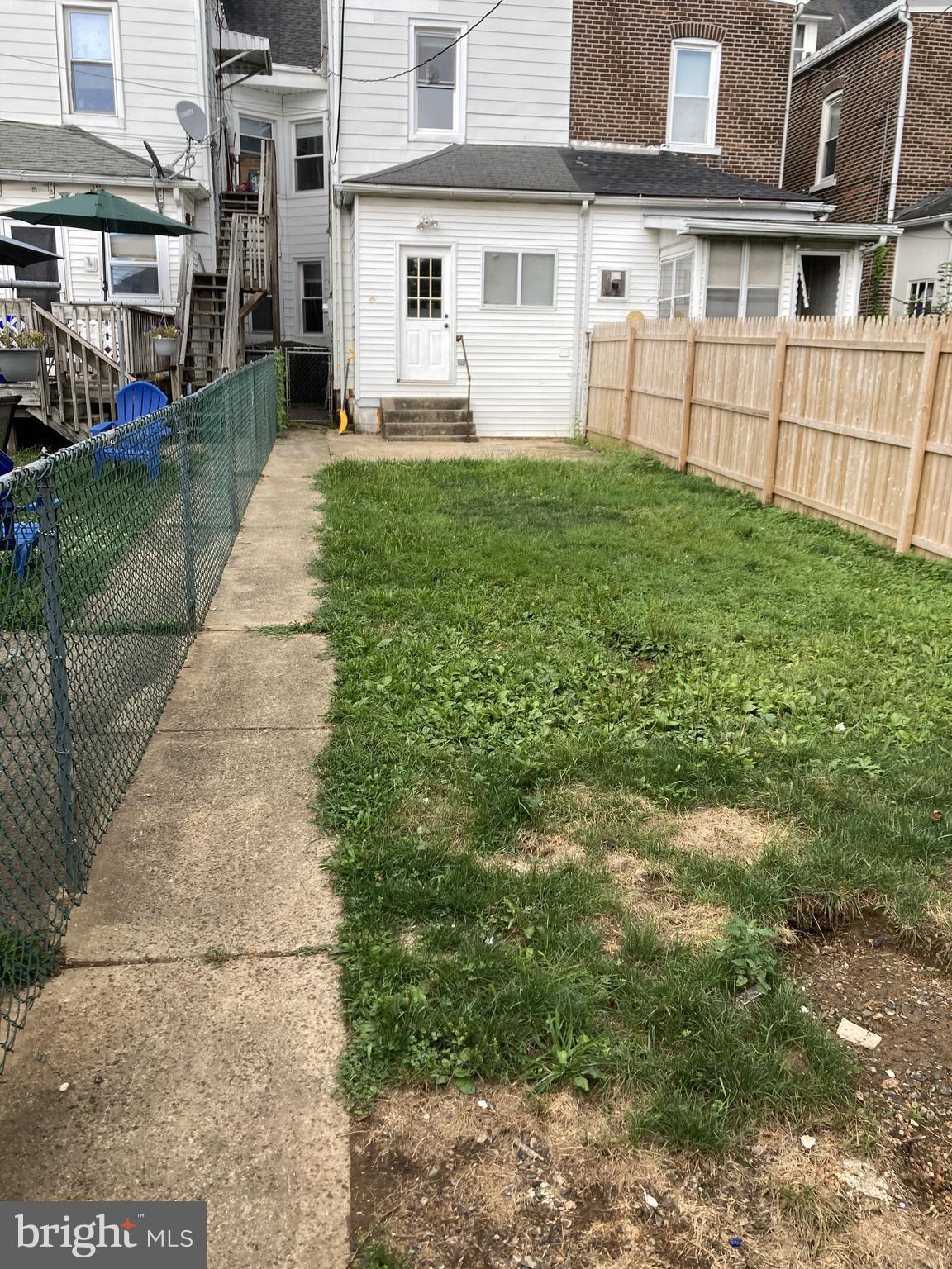 917 High Street Bethlehem, PA 18018 - Photo 2 of 3 a view of a white house with a yard and sitting area