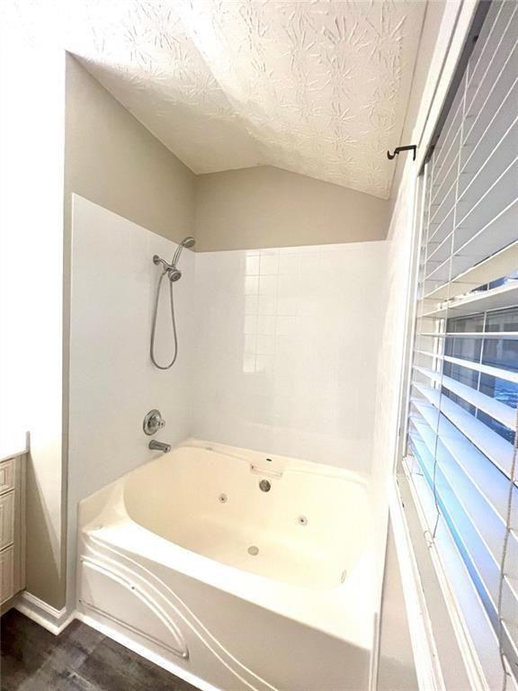 3854 Austin Park Lane Decatur, GA 30032 - Photo 27 of 44 a bathroom with a bathtub and shower