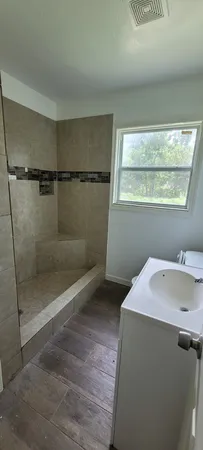 a bathroom with a sink and shower