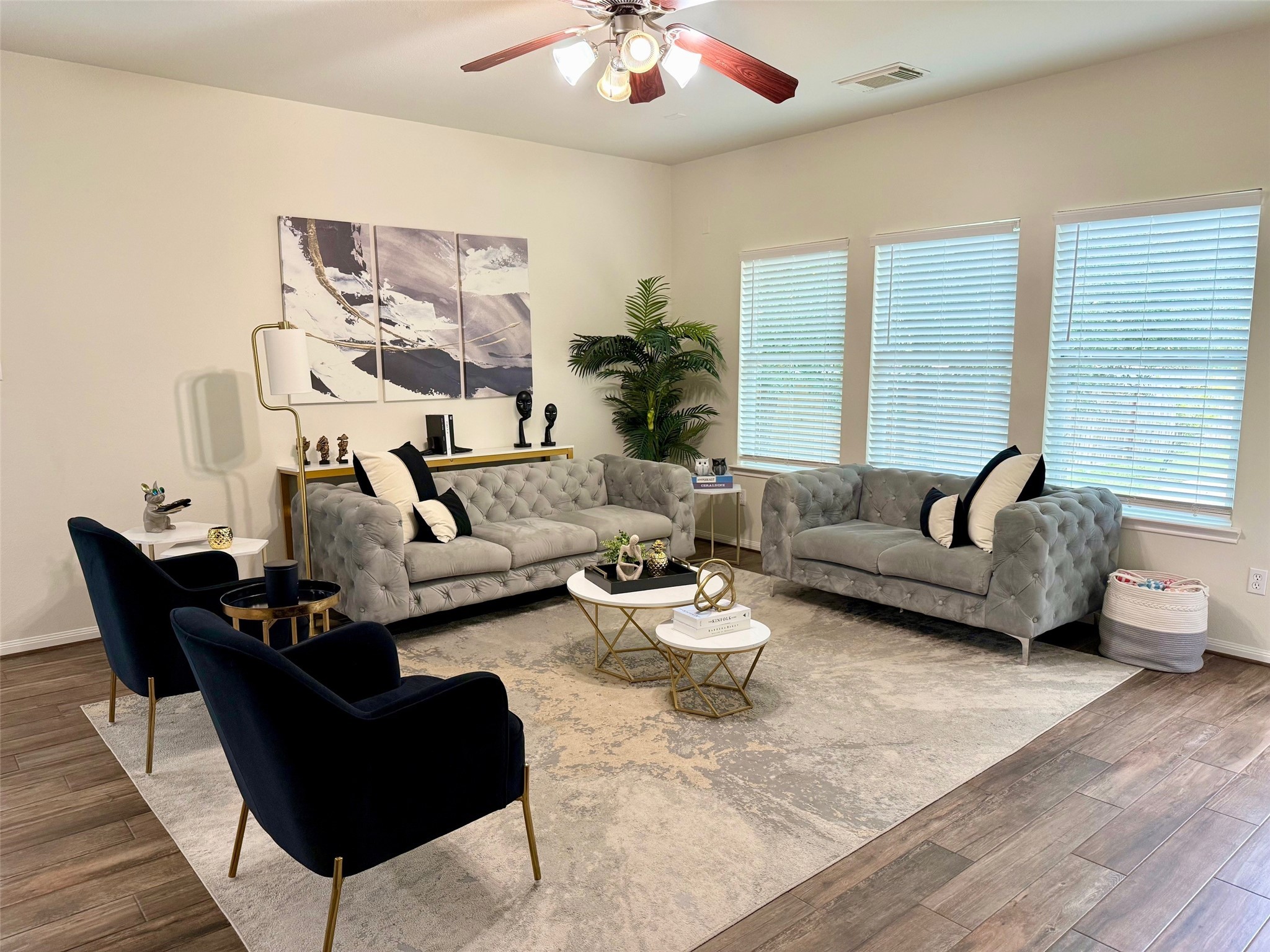 142 East Spindle Tree Circle The Woodlands, TX 77382 - Photo 11 of 37 a living room with furniture and a large window