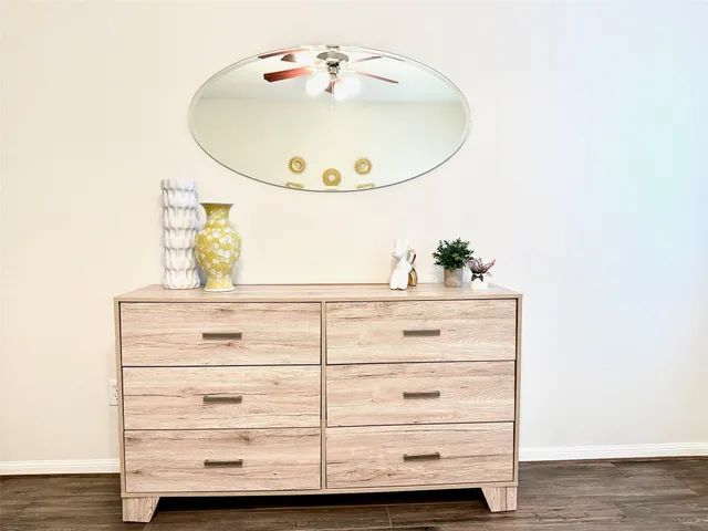 a close view of dresser and mirror