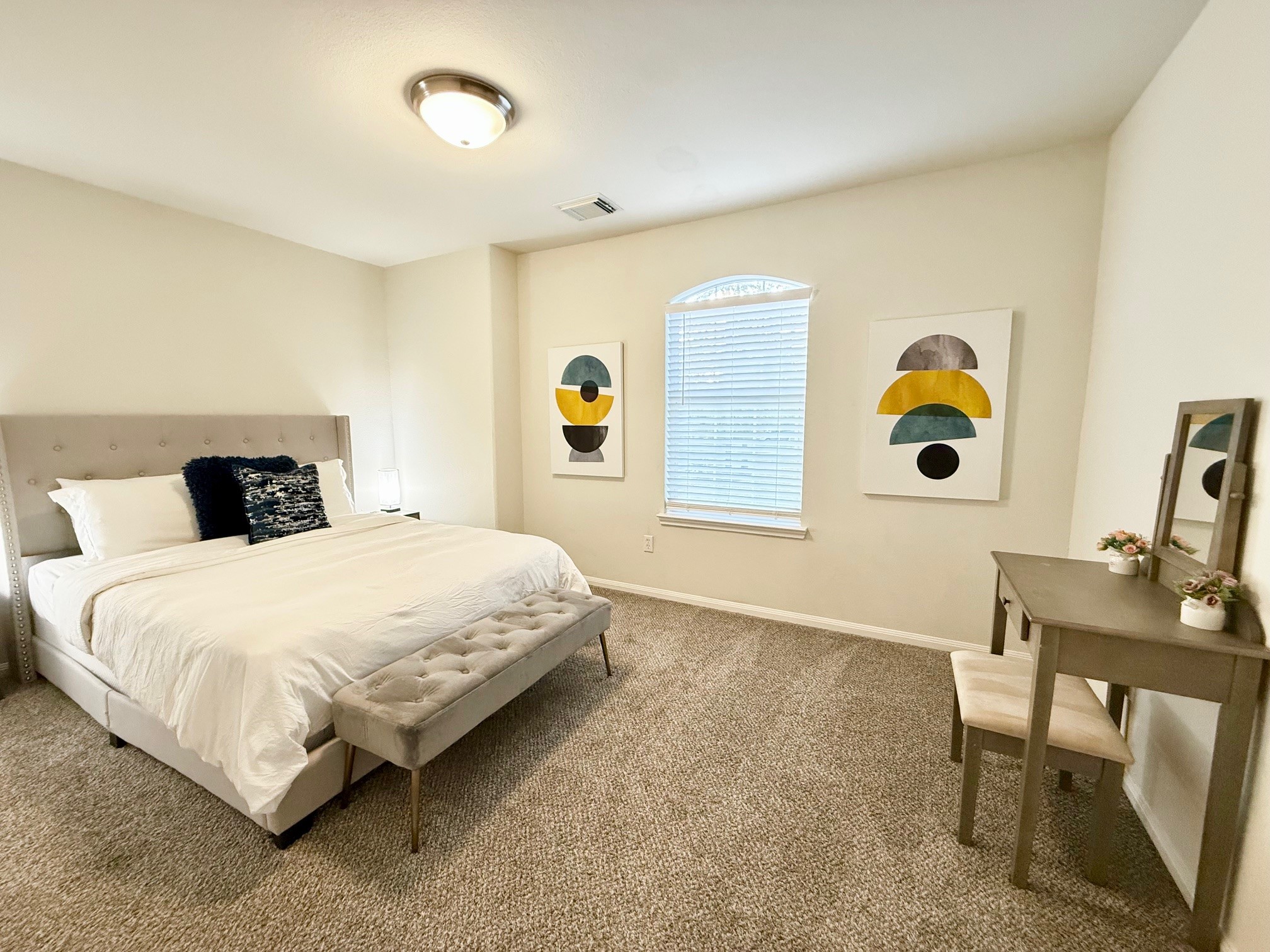 142 East Spindle Tree Circle The Woodlands, TX 77382 - Photo 20 of 37 a bedroom with a bed and a window