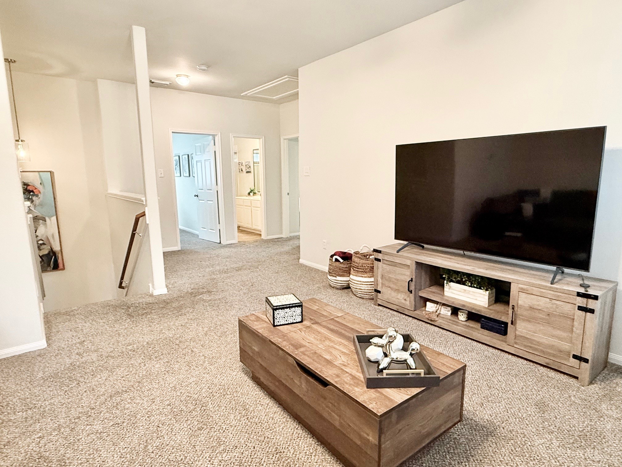 142 East Spindle Tree Circle The Woodlands, TX 77382 - Photo 34 of 37 a living room with furniture and a flat screen tv