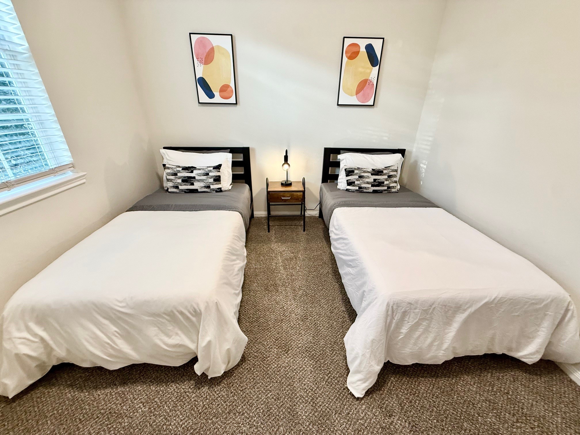 142 East Spindle Tree Circle The Woodlands, TX 77382 - Photo 35 of 37 a bedroom with a bed and wall painting