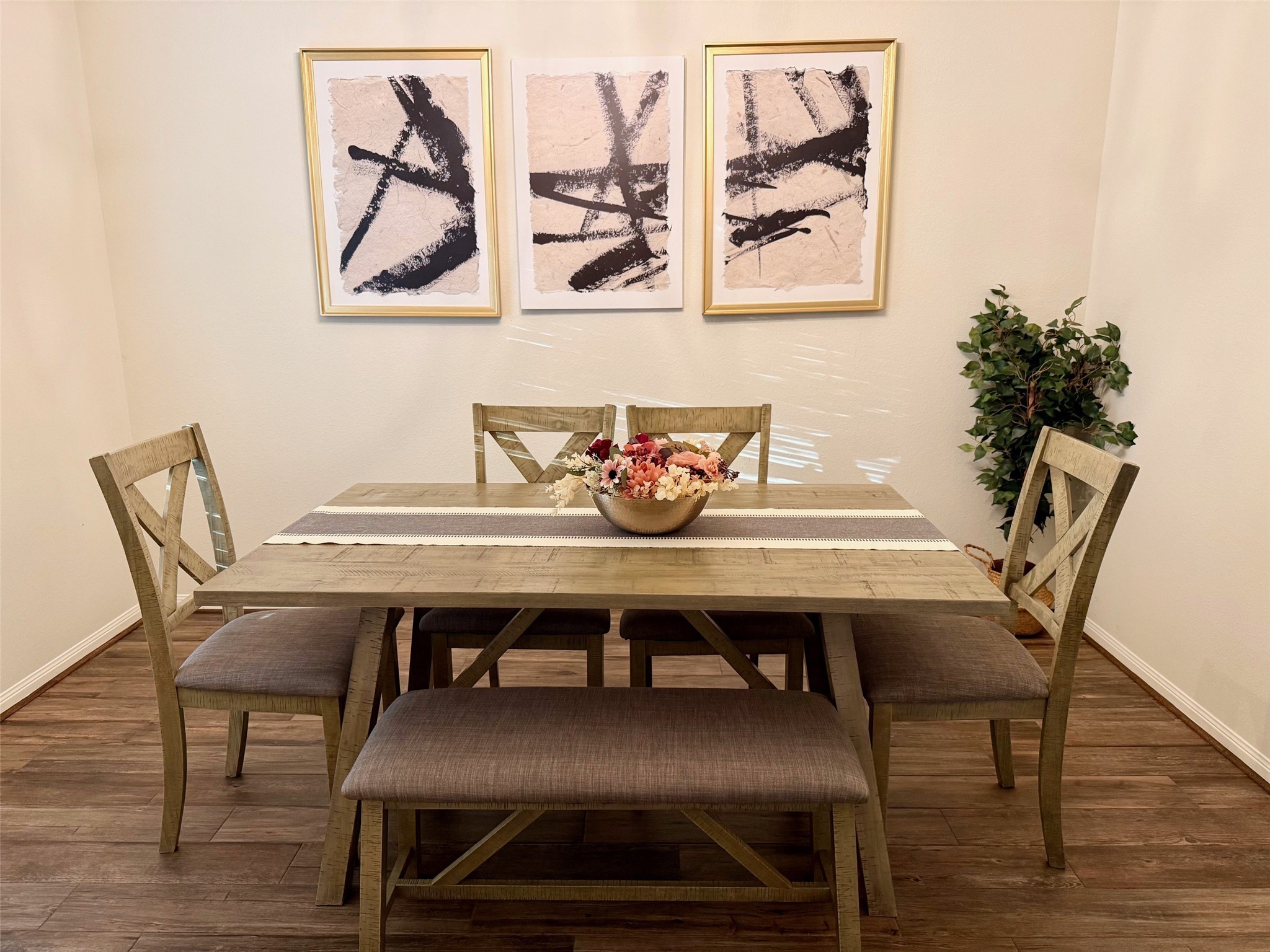 142 East Spindle Tree Circle The Woodlands, TX 77382 - Photo 5 of 37 a view of a dining room with furniture and wooden floor