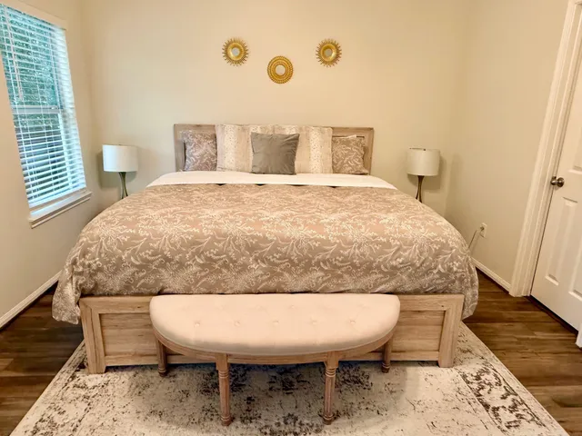 a living room with a chairs and a table