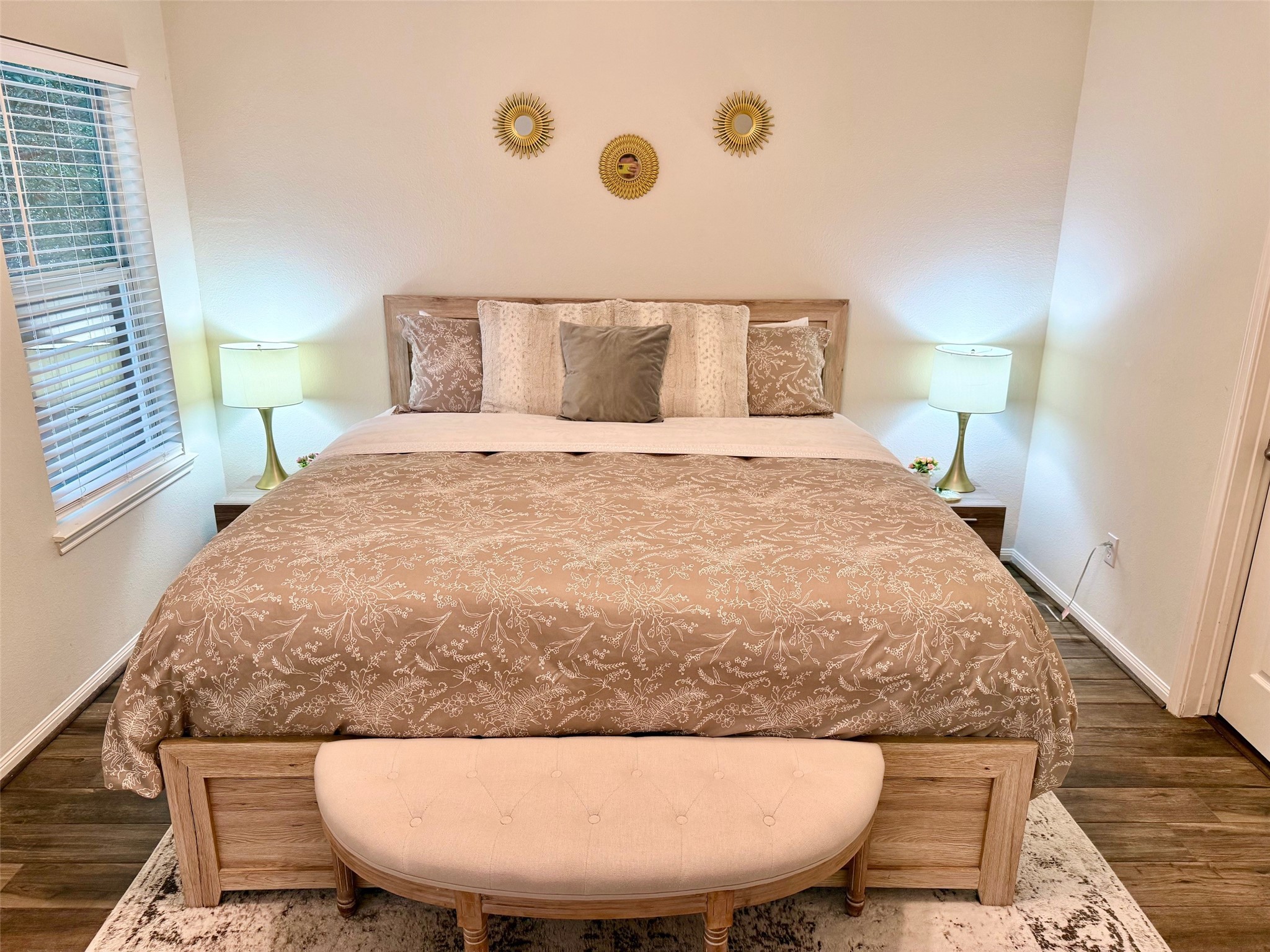 142 East Spindle Tree Circle The Woodlands, TX 77382 - Photo 7 of 37 a bed sitting in a bedroom next to a lamp