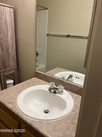 a swimming pool with outdoor seating and yard