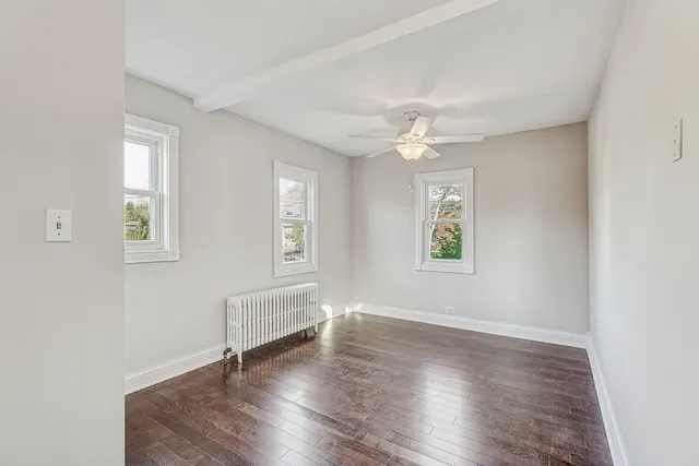 a view of a dining room with furniture and window