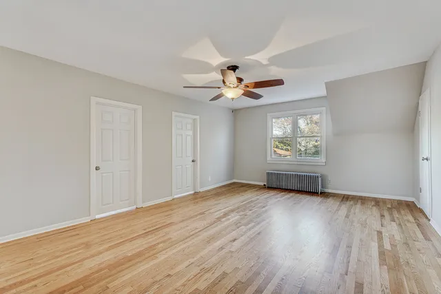 a white refrigerator freezer sitting in a kitchen with stainless steel appliances granite countertop furniture and a refrigerator