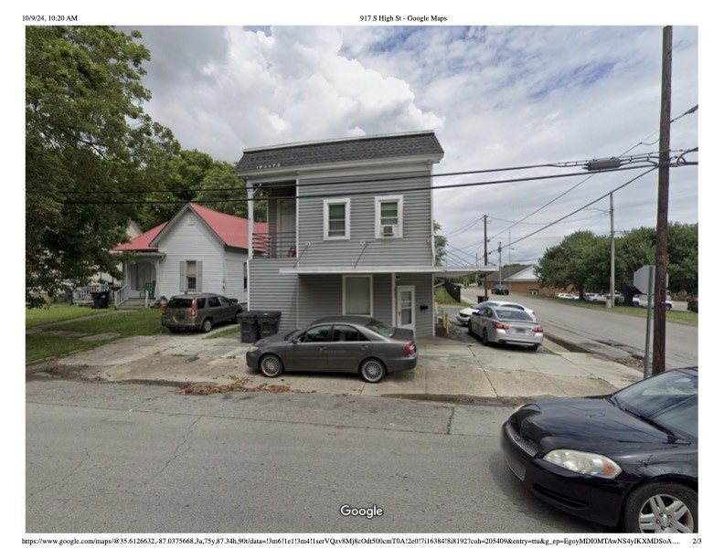 a car parked in front of a house
