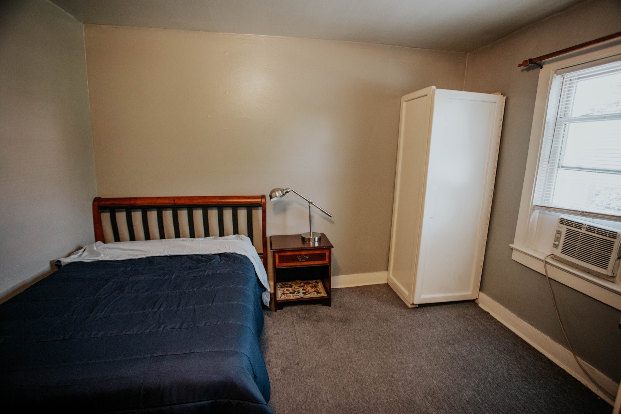 917 South High Street Columbia, TN 38401 - Photo 36 of 42 a bedroom with a bed and wooden floor