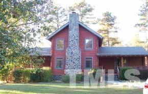 928 Dalrymple Road Cameron, NC 28326 - Photo 2 of 22 a view of a brick house with a yard