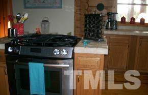 928 Dalrymple Road Cameron, NC 28326 - Photo 15 of 22 a kitchen with a stove and cabinets