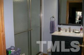 928 Dalrymple Road Cameron, NC 28326 - Photo 10 of 22 a bathroom with a sink and a mirror