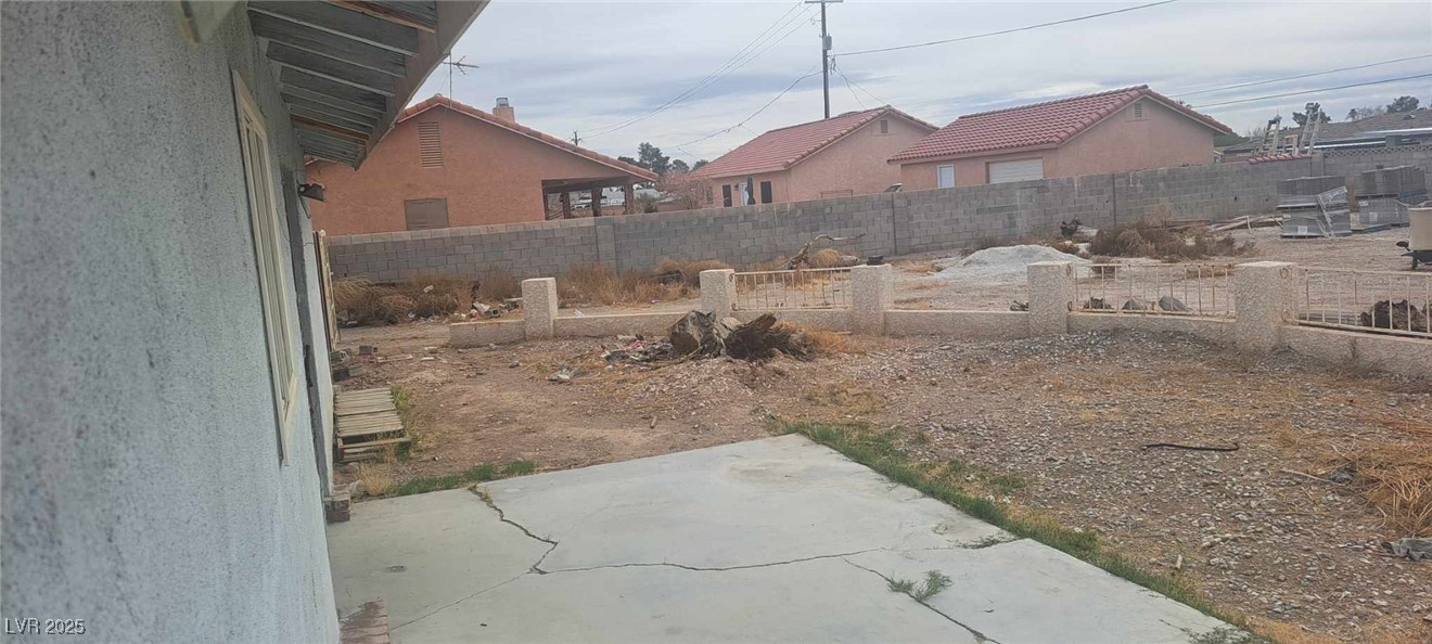 5231 Smoke Ranch Road Las Vegas, NV 89108 - Photo 22 of 23 View of yard featuring a patio and a fenced backyard