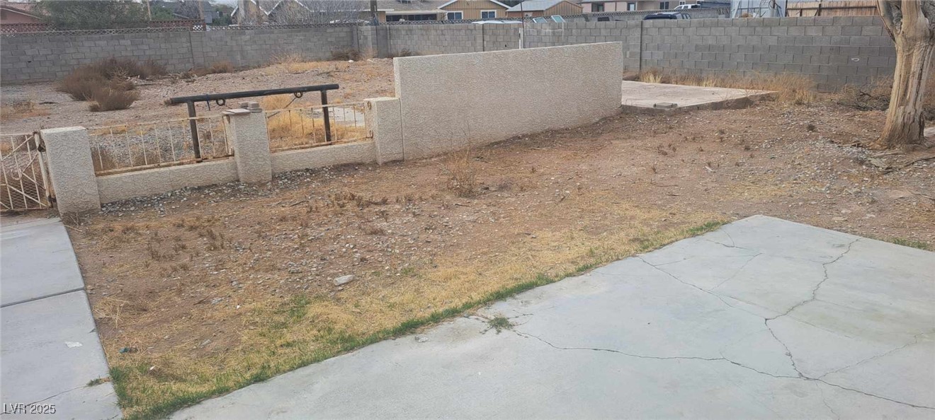 5231 Smoke Ranch Road Las Vegas, NV 89108 - Photo 23 of 23 View of yard featuring fence private yard