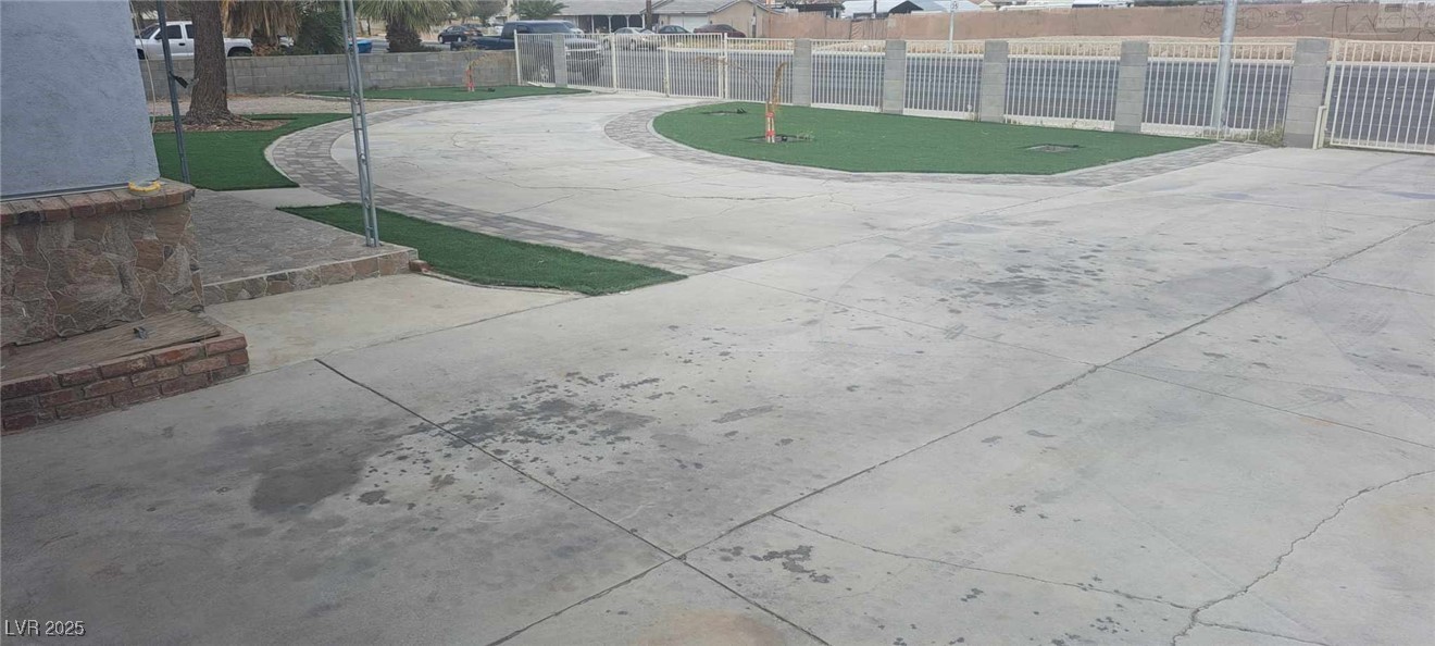 View of yard featuring fence