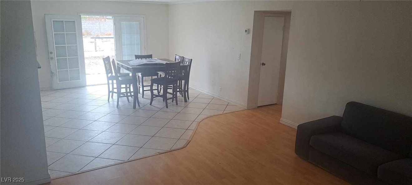 5231 Smoke Ranch Road Las Vegas, NV 89108 - Photo 8 of 23 Dining room with light tile patterned flooring and baseboards