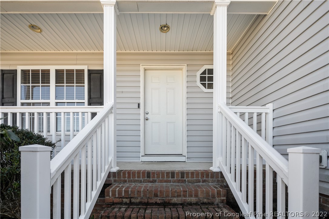 57 Pender Road Spring Lake, NC 28390 - Photo 3 of 50 a view of a house with wooden door and deck