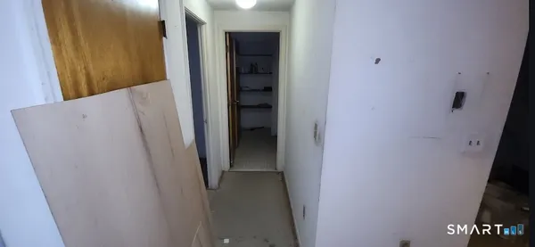 a view of a workspace with furniture and gym equipment