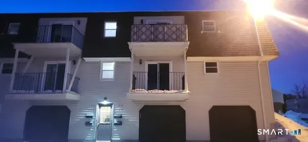 a view of living room with furniture and a fireplace