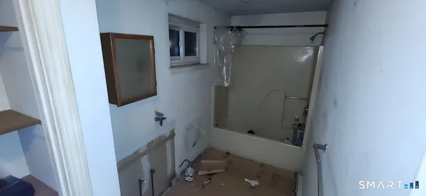 a bathroom with a shower and toilet