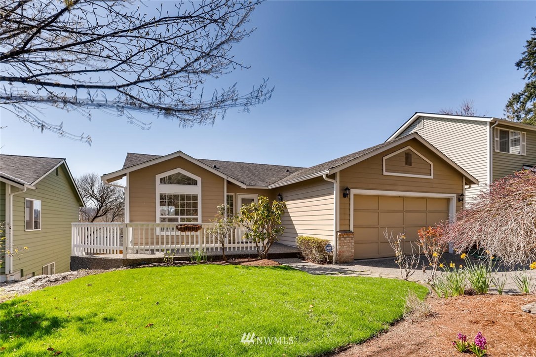 21022 25th Drive Southeast Bothell, WA 98021 - Photo 1 of 27 a front view of a house with a yard and garage