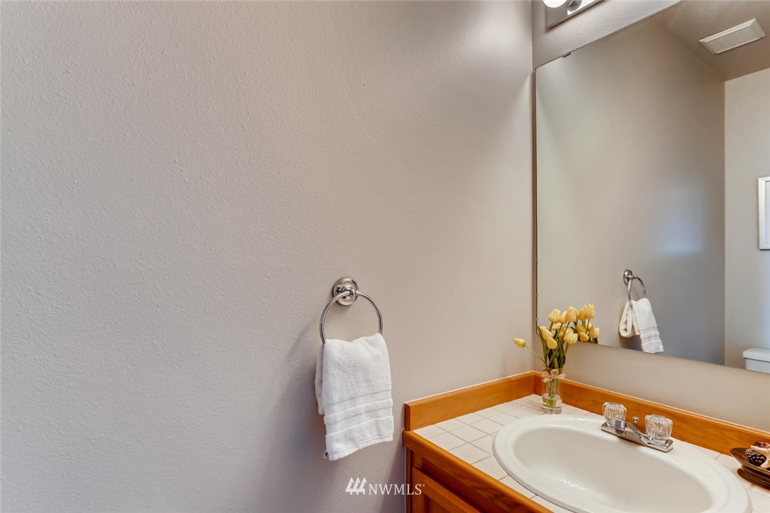 21022 25th Drive Southeast Bothell, WA 98021 - Photo 15 of 27 a bathroom with a sink and a mirror