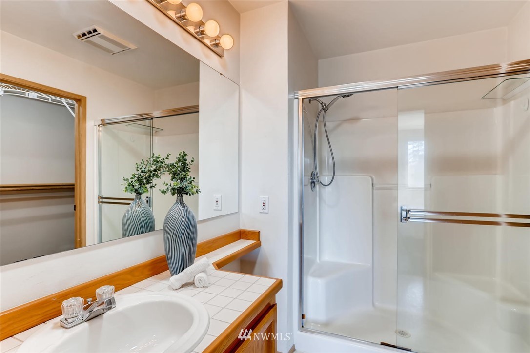 21022 25th Drive Southeast Bothell, WA 98021 - Photo 19 of 27 a bath room with a bath tub and shower