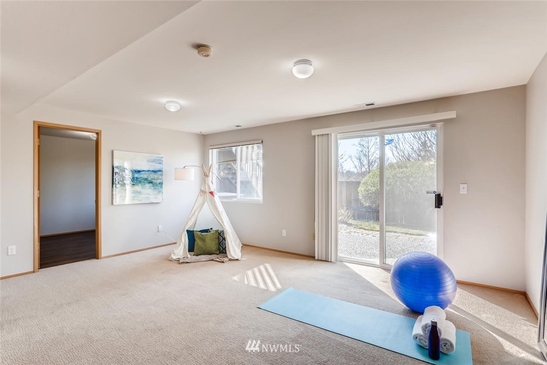 21022 25th Drive Southeast Bothell, WA 98021 - Photo 20 of 27 a living room with furniture and a floor to ceiling window