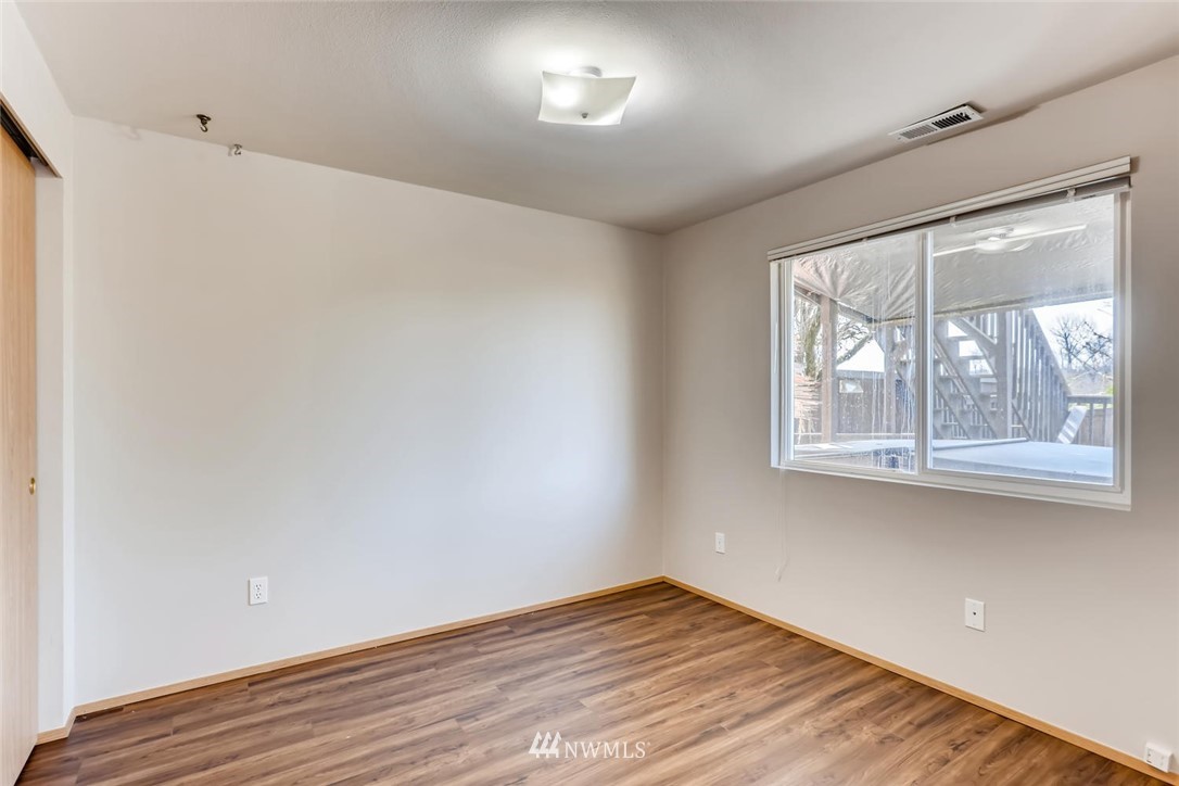 21022 25th Drive Southeast Bothell, WA 98021 - Photo 22 of 27 a view of empty room with wooden floor and fan