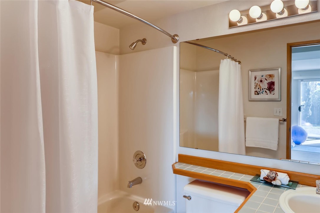 21022 25th Drive Southeast Bothell, WA 98021 - Photo 25 of 27 a bathroom with a tub and shower