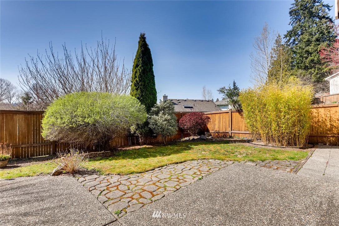 21022 25th Drive Southeast Bothell, WA 98021 - Photo 27 of 27 a view of a backyard with a fountain plants and large tree
