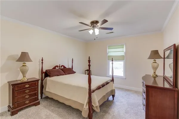 a bed room with a bed and a dresser
