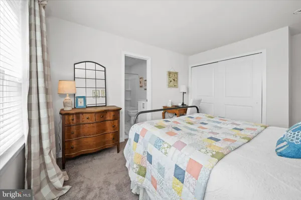 a view of a room with furniture and wooden floor