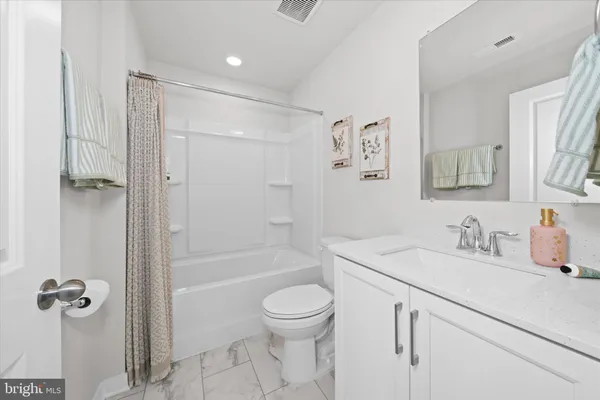 a bathroom with a toilet and a sink
