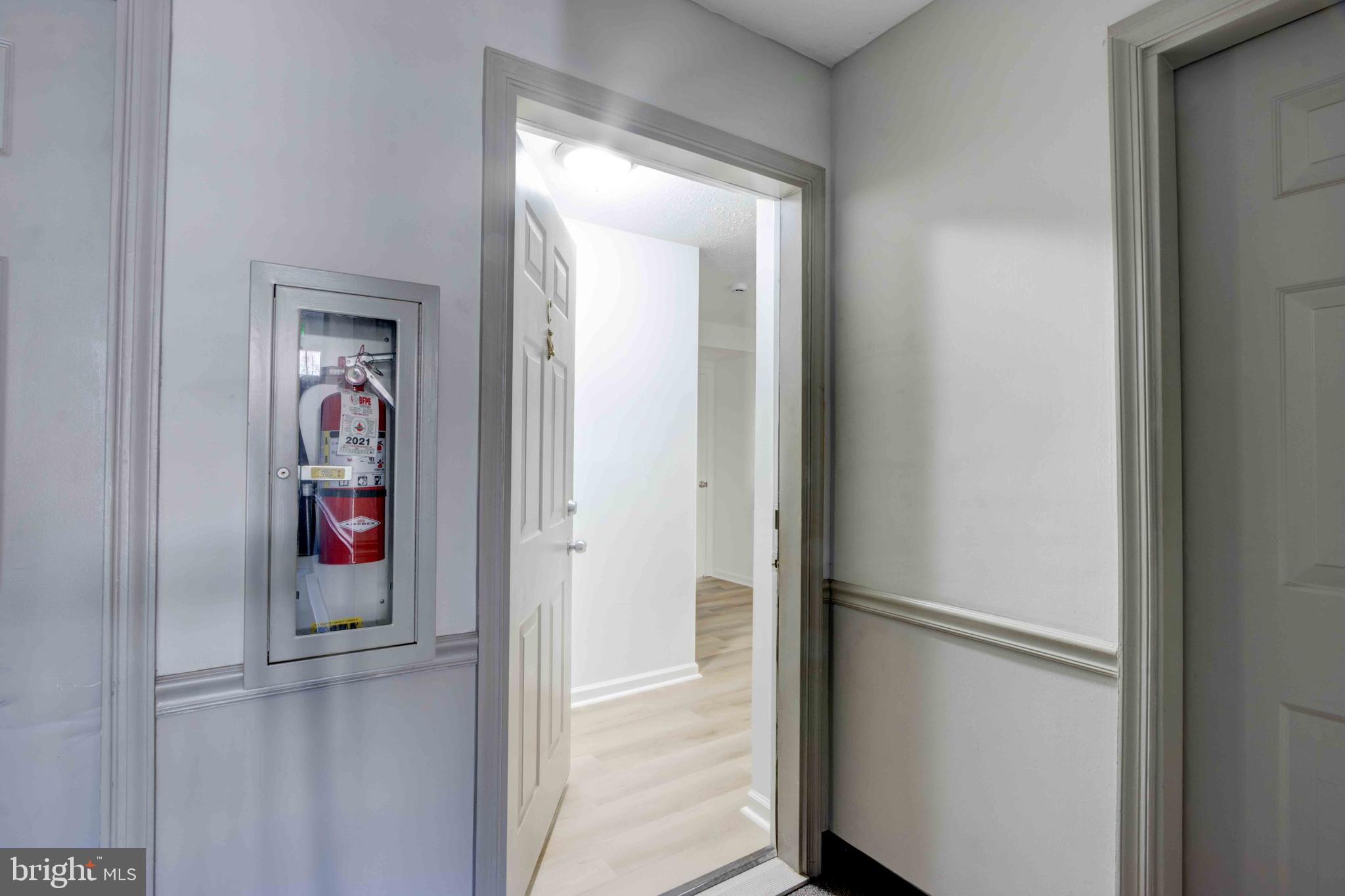 7903 Valley Manor Road, Unit 103 Owings Mills, MD 21117 - Photo 14 of 58 a view of an entryway with a hallway