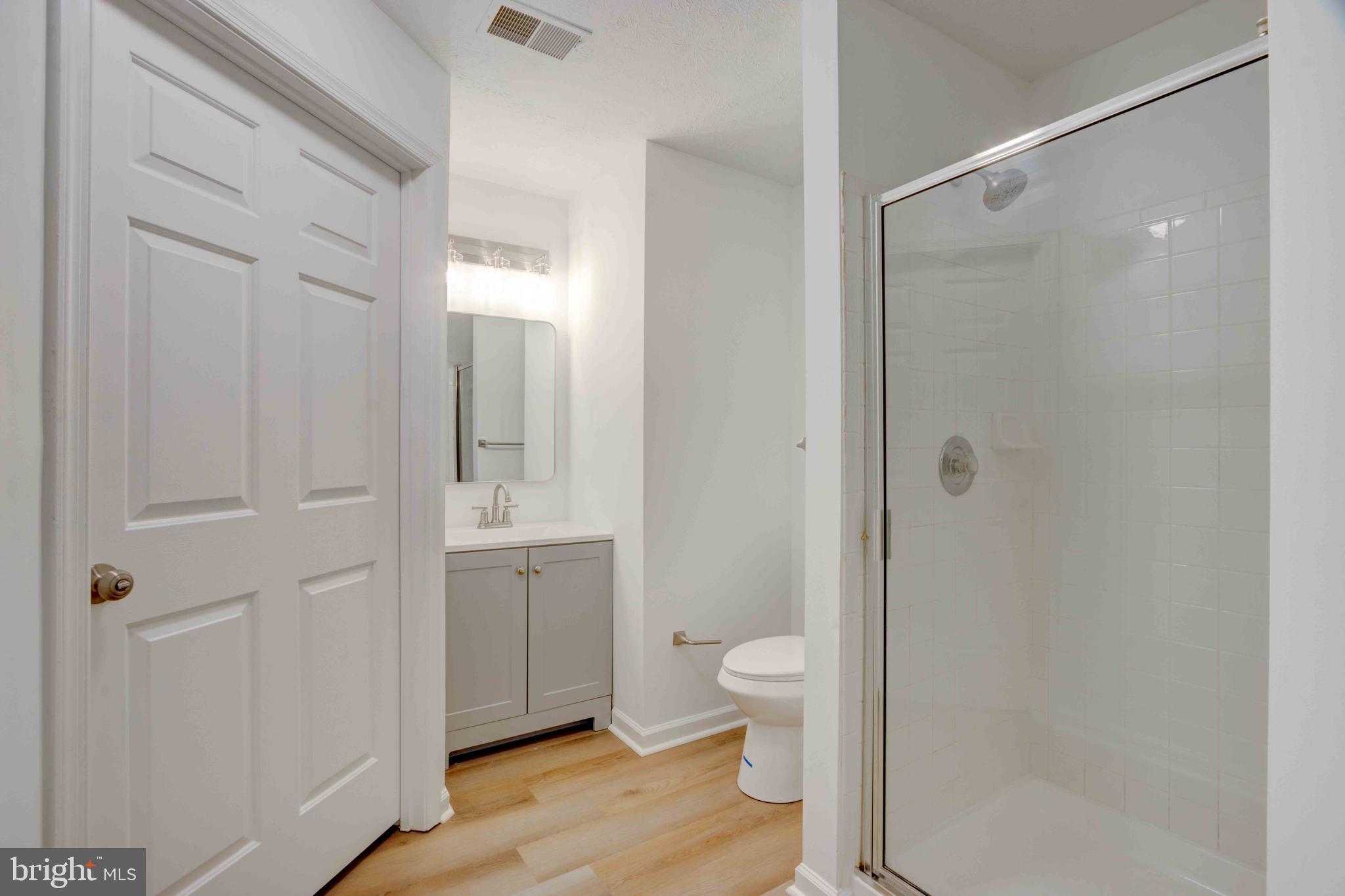 7903 Valley Manor Road, Unit 103 Owings Mills, MD 21117 - Photo 35 of 58 a bathroom with a toilet shower and a sink