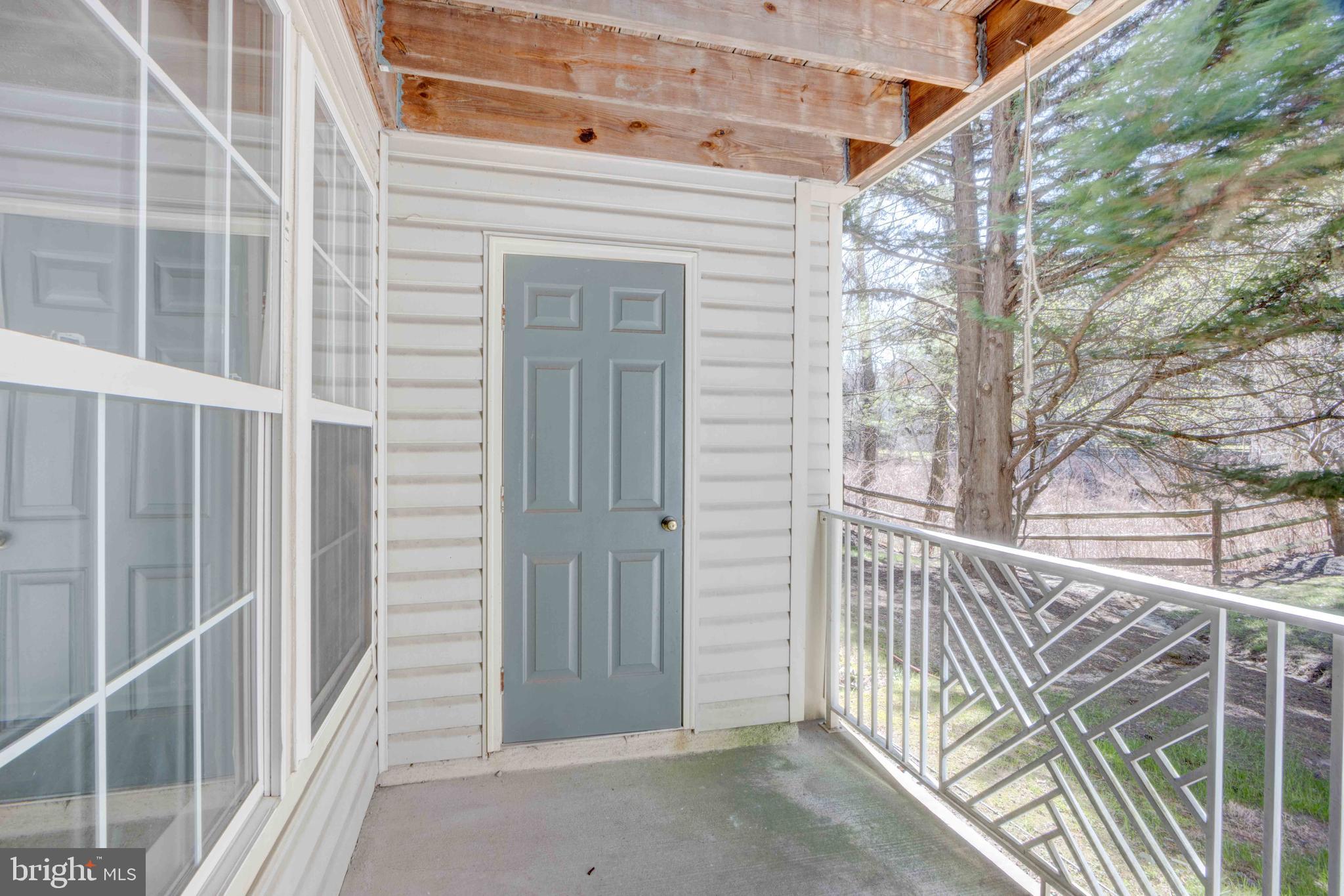7903 Valley Manor Road, Unit 103 Owings Mills, MD 21117 - Photo 39 of 58 a view of a house with a large window