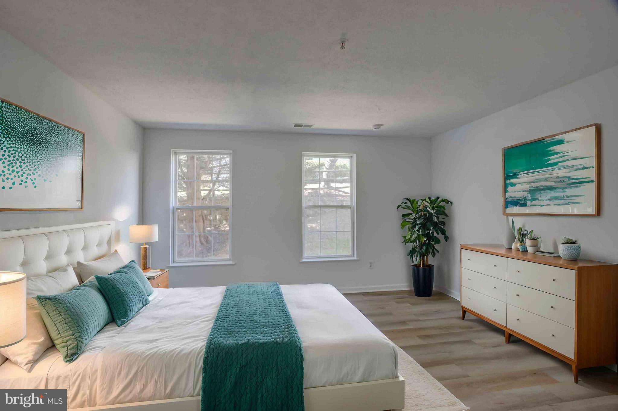 7903 Valley Manor Road, Unit 103 Owings Mills, MD 21117 - Photo 44 of 58 a bedroom with a large bed and a window