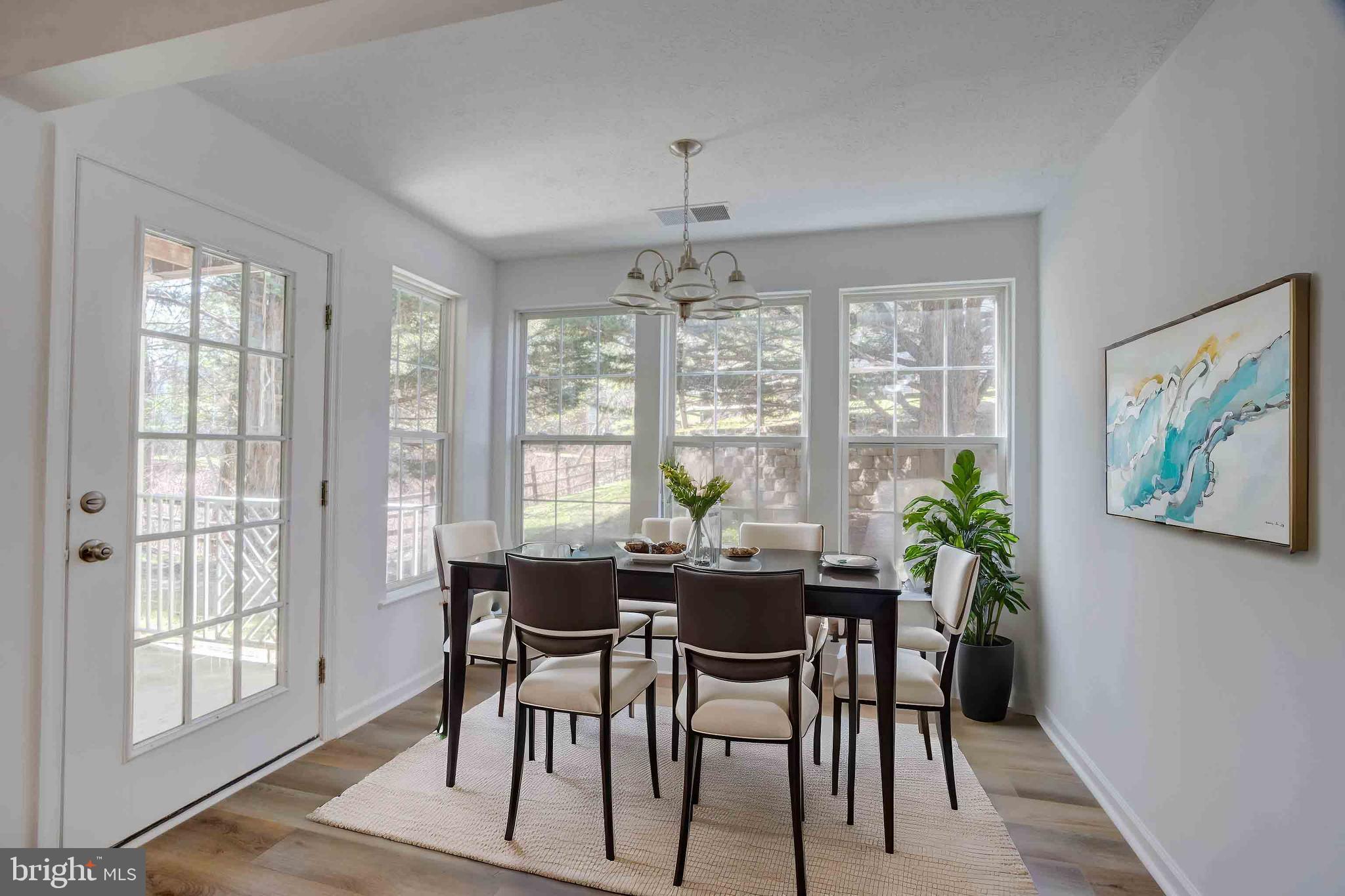 7903 Valley Manor Road, Unit 103 Owings Mills, MD 21117 - Photo 54 of 58 a view of a dining room with furniture window and outside view