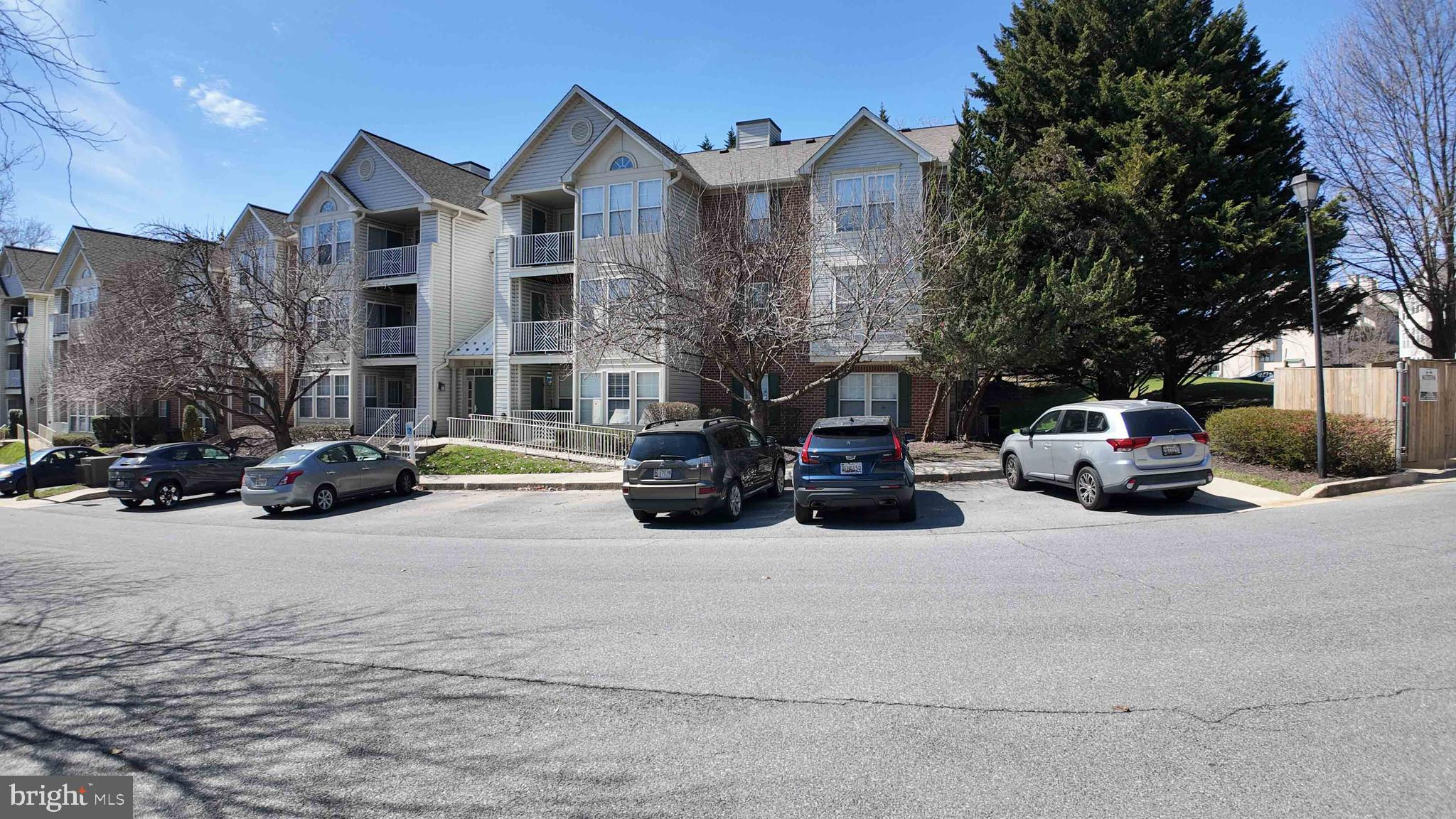 7903 Valley Manor Road, Unit 103 Owings Mills, MD 21117 - Photo 6 of 58 a view of a car parked in front of a building