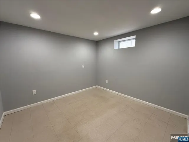 an empty room with wooden floor