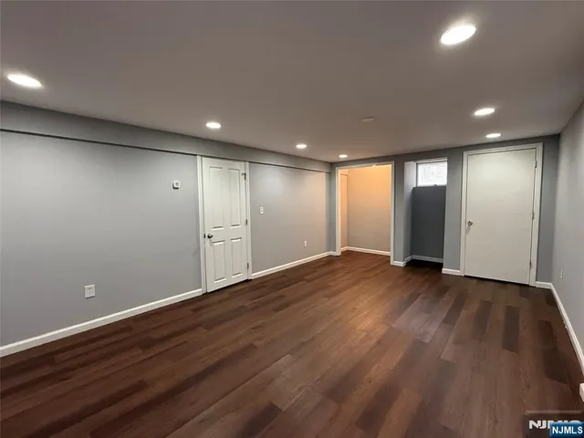 a view of room with wooden floor and window