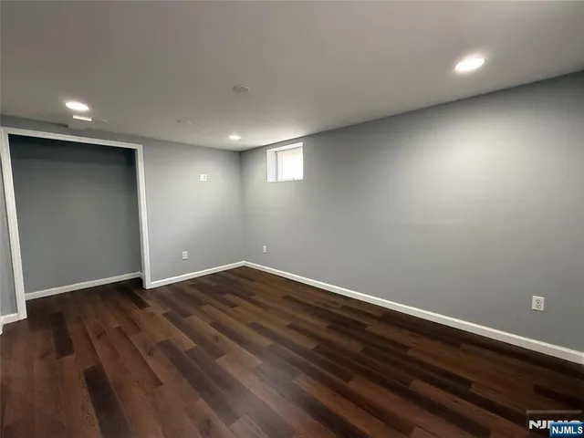 a view of gallery with wooden floor